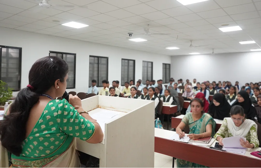 Faculty addressing students during a lecture